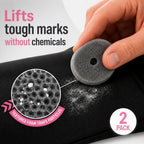 Close-up of a Skid Out sponge lifting a white powder mark off black fabric, with a magnified inset showing the textured foam trapping particles